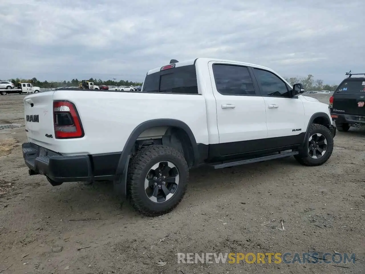 3 Photograph of a damaged car 1C6SRFLT4MN721557 RAM 1500 2021
