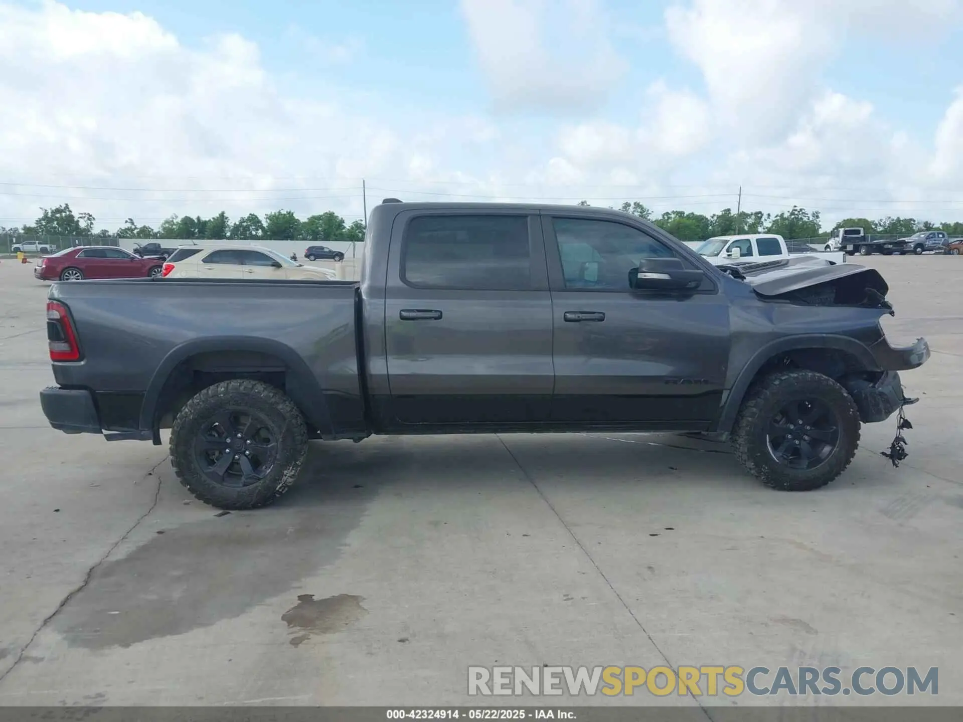 12 Photograph of a damaged car 1C6SRFLT7MN537312 RAM 1500 2021