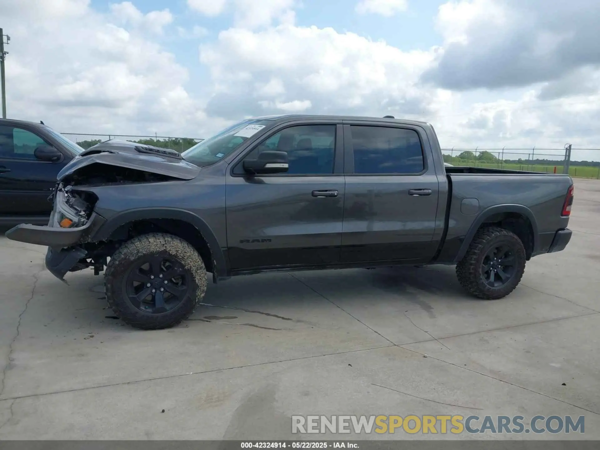 13 Photograph of a damaged car 1C6SRFLT7MN537312 RAM 1500 2021