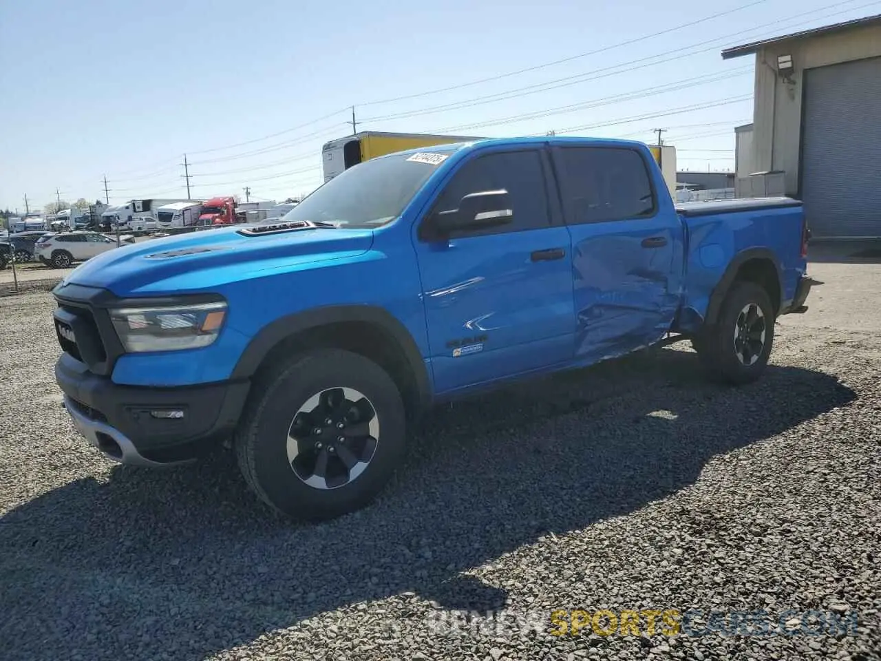 1 Photograph of a damaged car 1C6SRFLT8MN598457 RAM 1500 2021