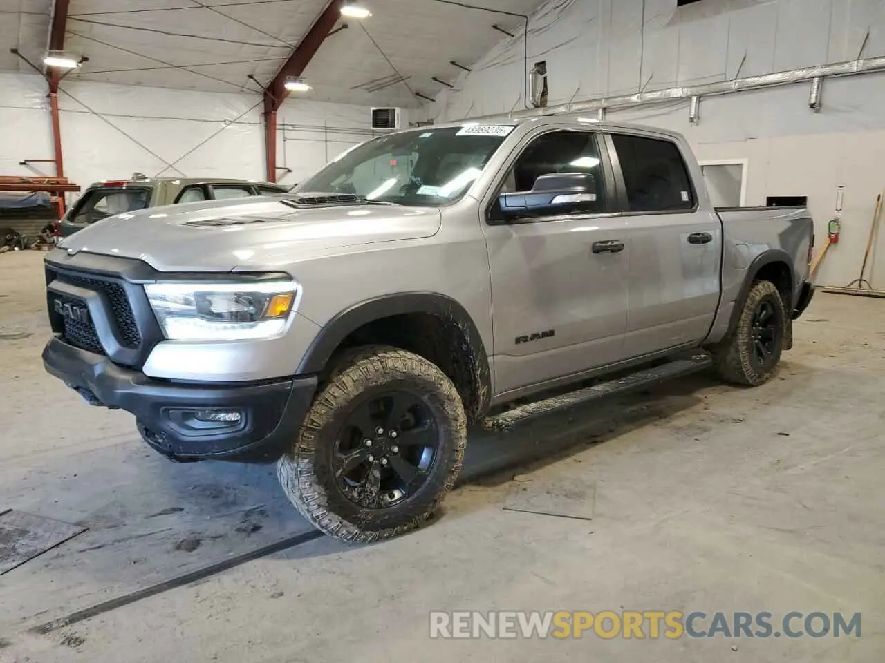 1 Photograph of a damaged car 1C6SRFLT8MN655627 RAM 1500 2021