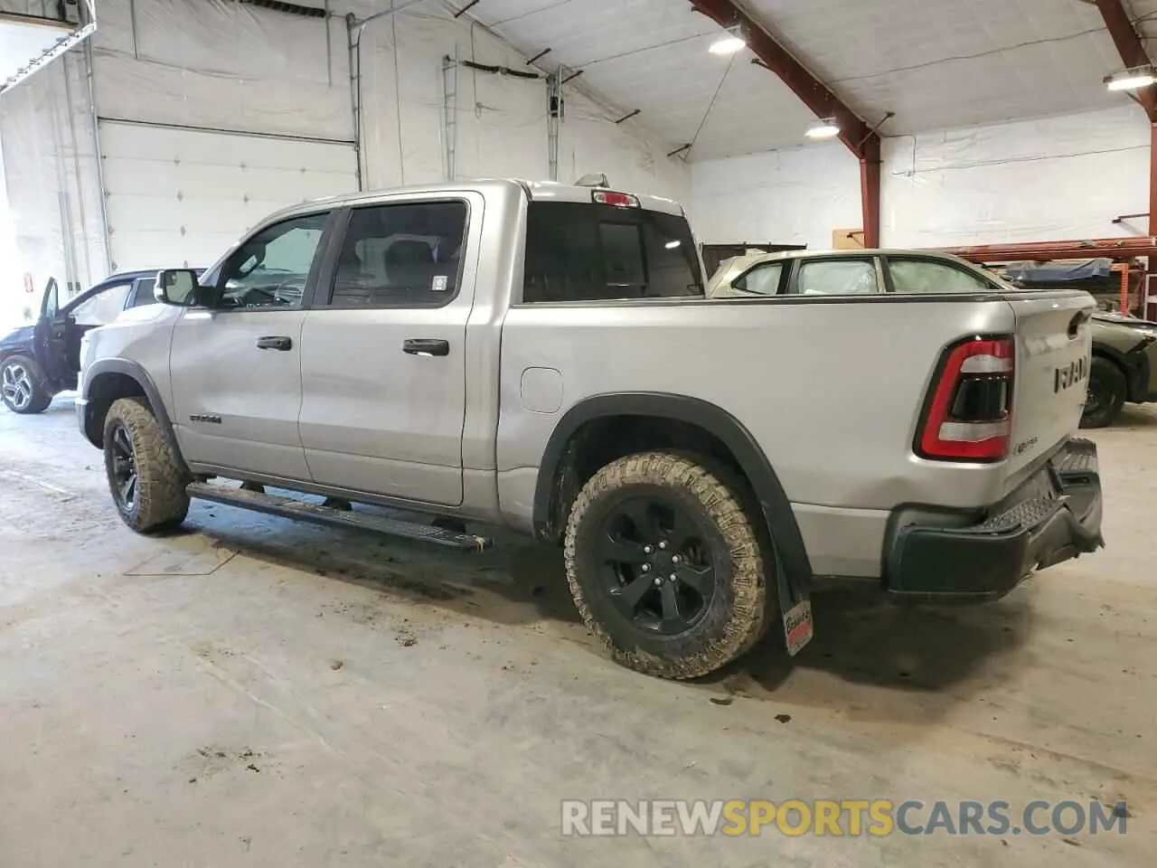 2 Photograph of a damaged car 1C6SRFLT8MN655627 RAM 1500 2021