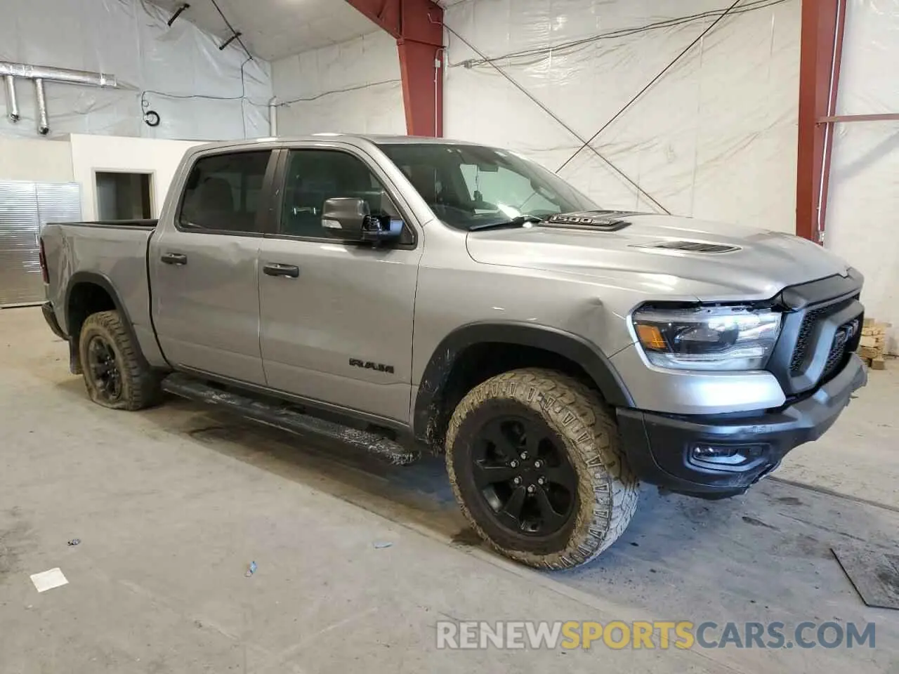 4 Photograph of a damaged car 1C6SRFLT8MN655627 RAM 1500 2021