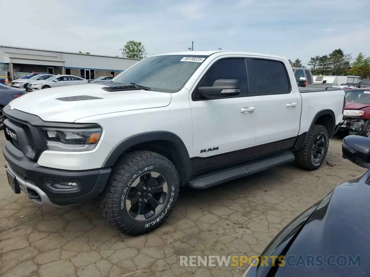 1 Photograph of a damaged car 1C6SRFLT9MN518387 RAM 1500 2021