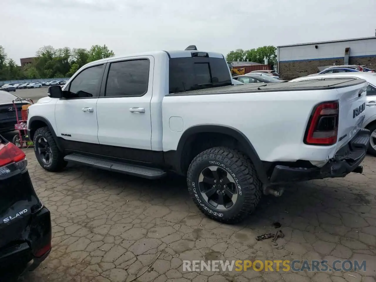 2 Photograph of a damaged car 1C6SRFLT9MN518387 RAM 1500 2021