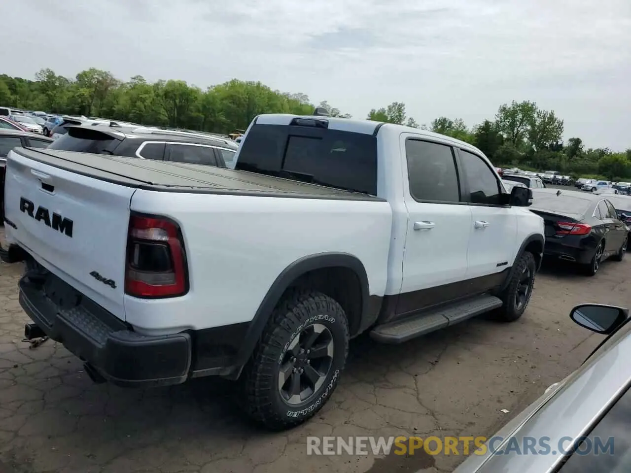 3 Photograph of a damaged car 1C6SRFLT9MN518387 RAM 1500 2021