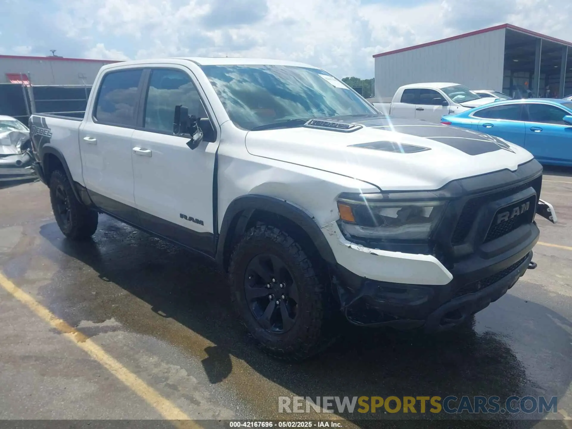 1 Photograph of a damaged car 1C6SRFLTXMN570577 RAM 1500 2021