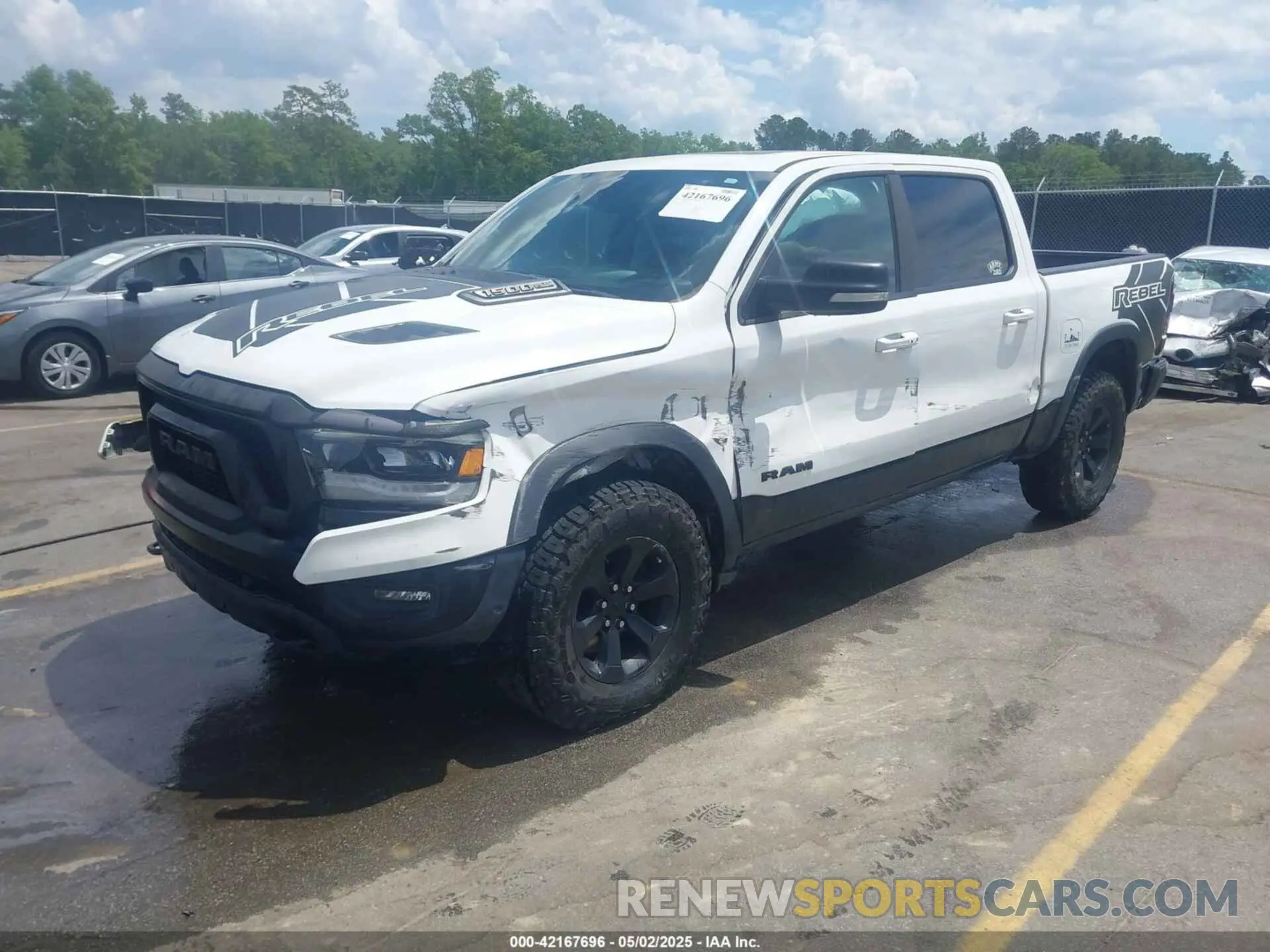 2 Photograph of a damaged car 1C6SRFLTXMN570577 RAM 1500 2021