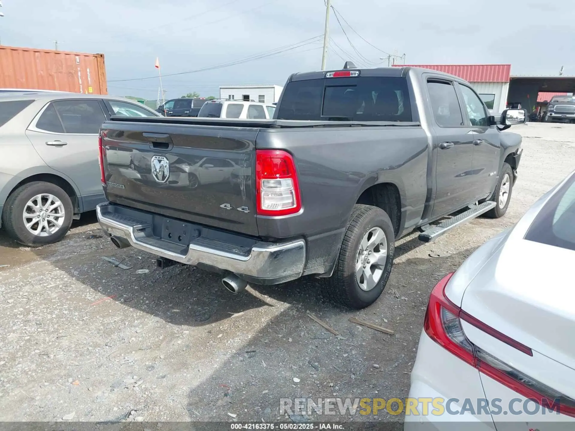 4 Photograph of a damaged car 1C6SRFMT0MN672355 RAM 1500 2021