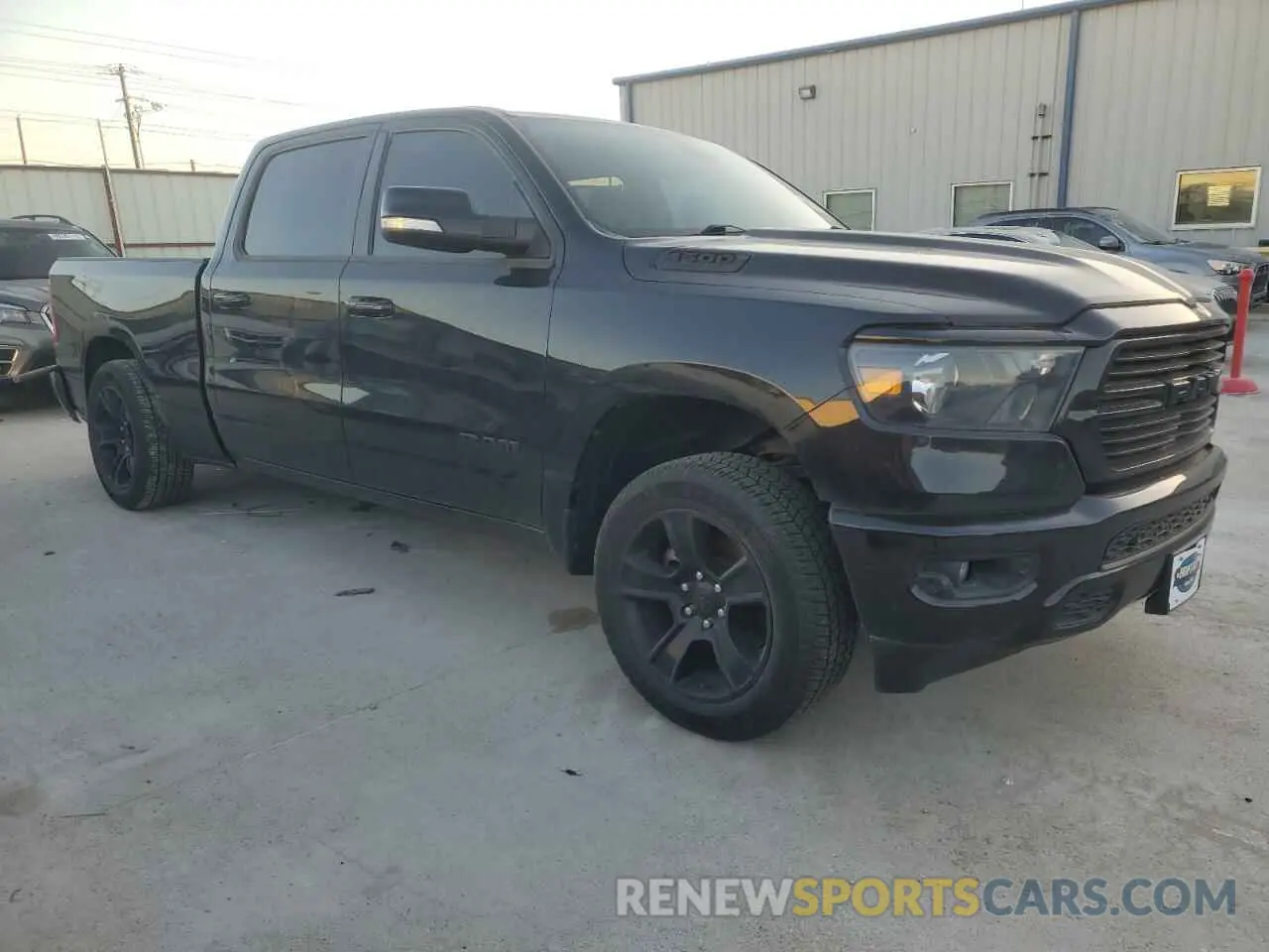 4 Photograph of a damaged car 1C6SRFMT1MN800828 RAM 1500 2021