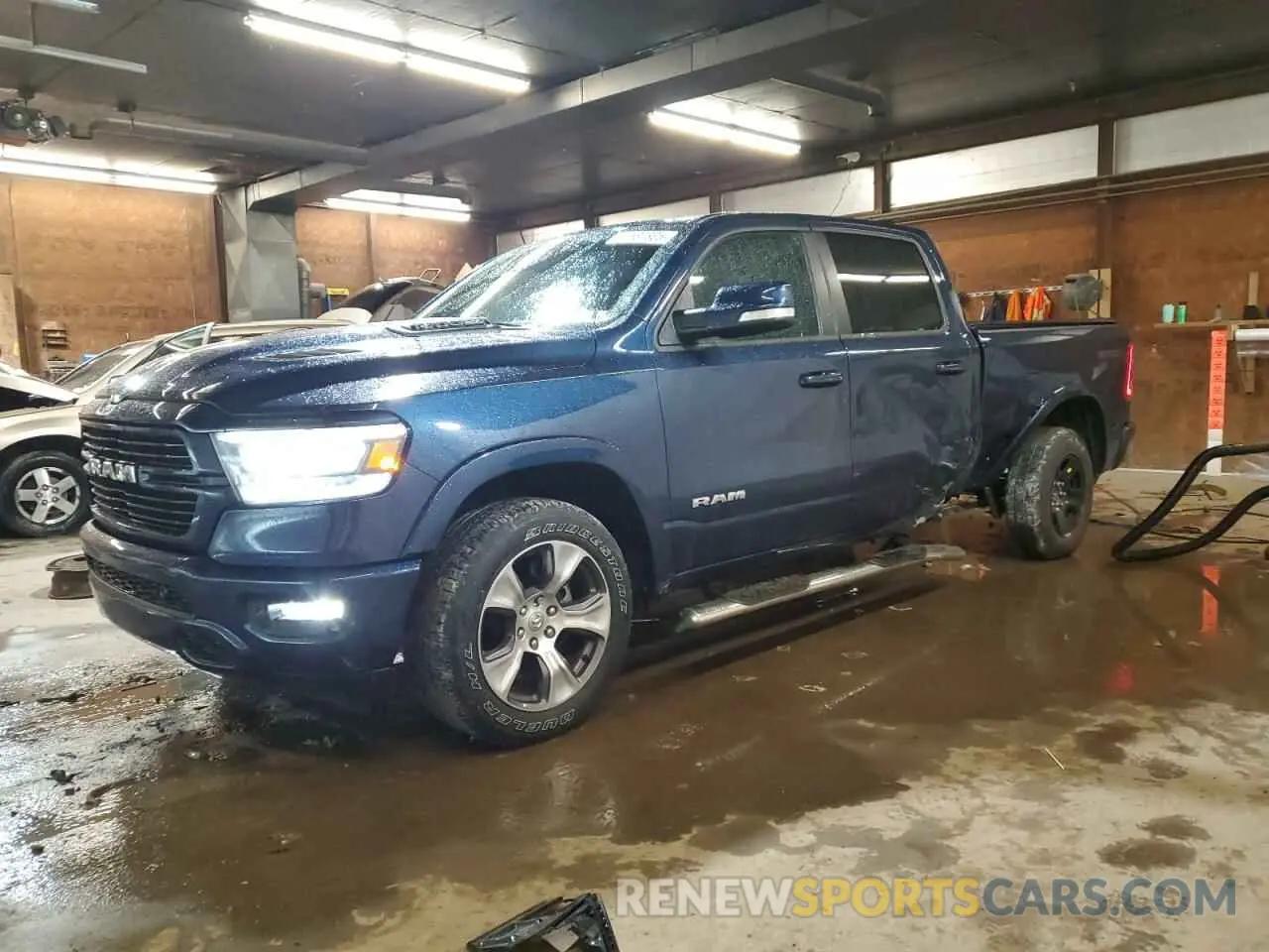 1 Photograph of a damaged car 1C6SRFRT2MN699534 RAM 1500 2021
