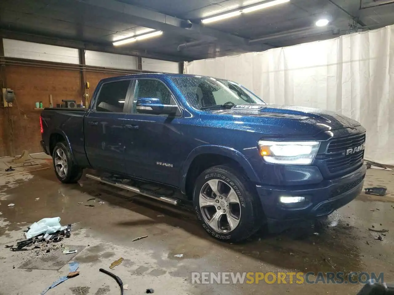 4 Photograph of a damaged car 1C6SRFRT2MN699534 RAM 1500 2021