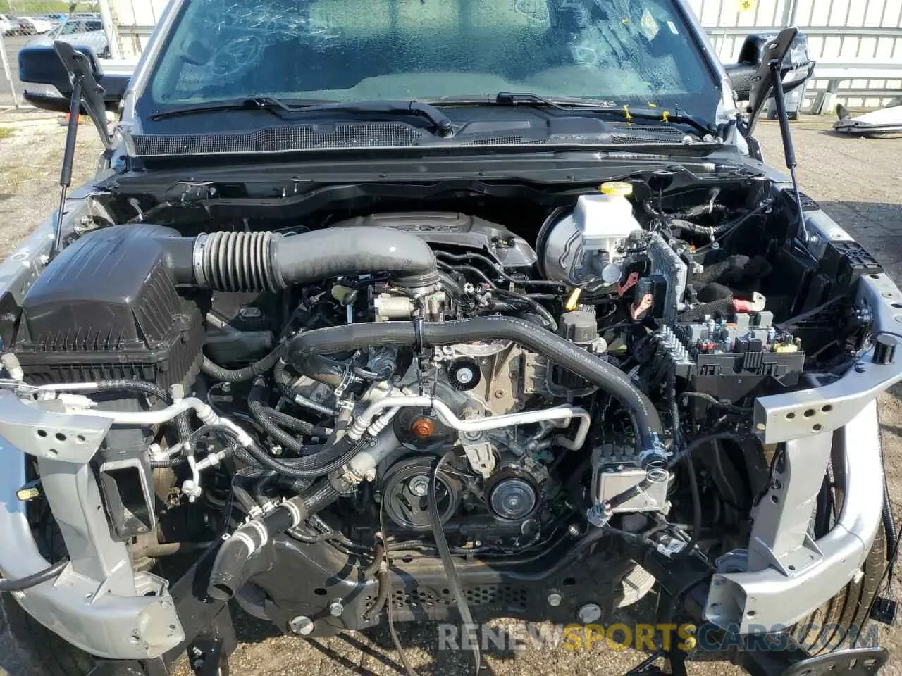 11 Photograph of a damaged car 1C6SRFRT5MN740318 RAM 1500 2021