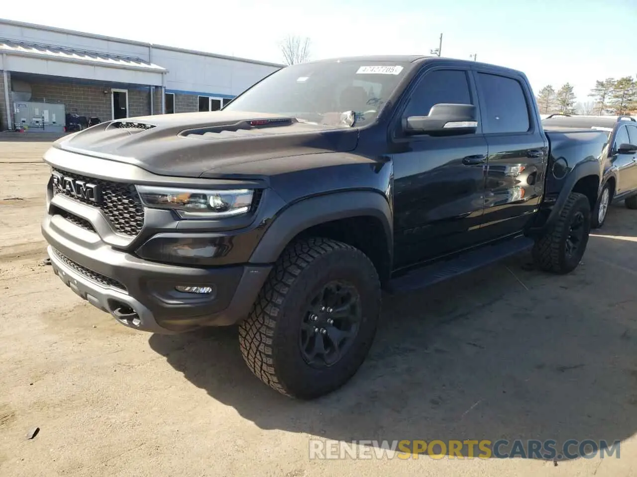 1 Photograph of a damaged car 1C6SRFU90MN901475 RAM 1500 2021
