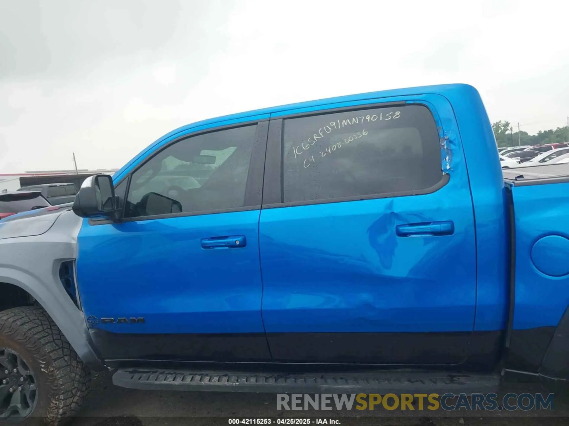 14 Photograph of a damaged car 1C6SRFU91MN790158 RAM 1500 2021
