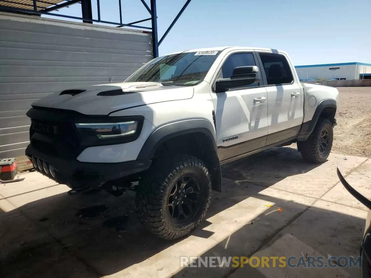 1 Photograph of a damaged car 1C6SRFU91MN804608 RAM 1500 2021