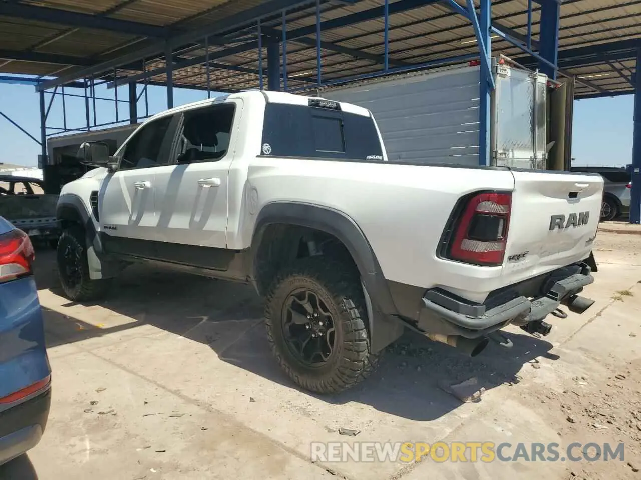 2 Photograph of a damaged car 1C6SRFU91MN804608 RAM 1500 2021