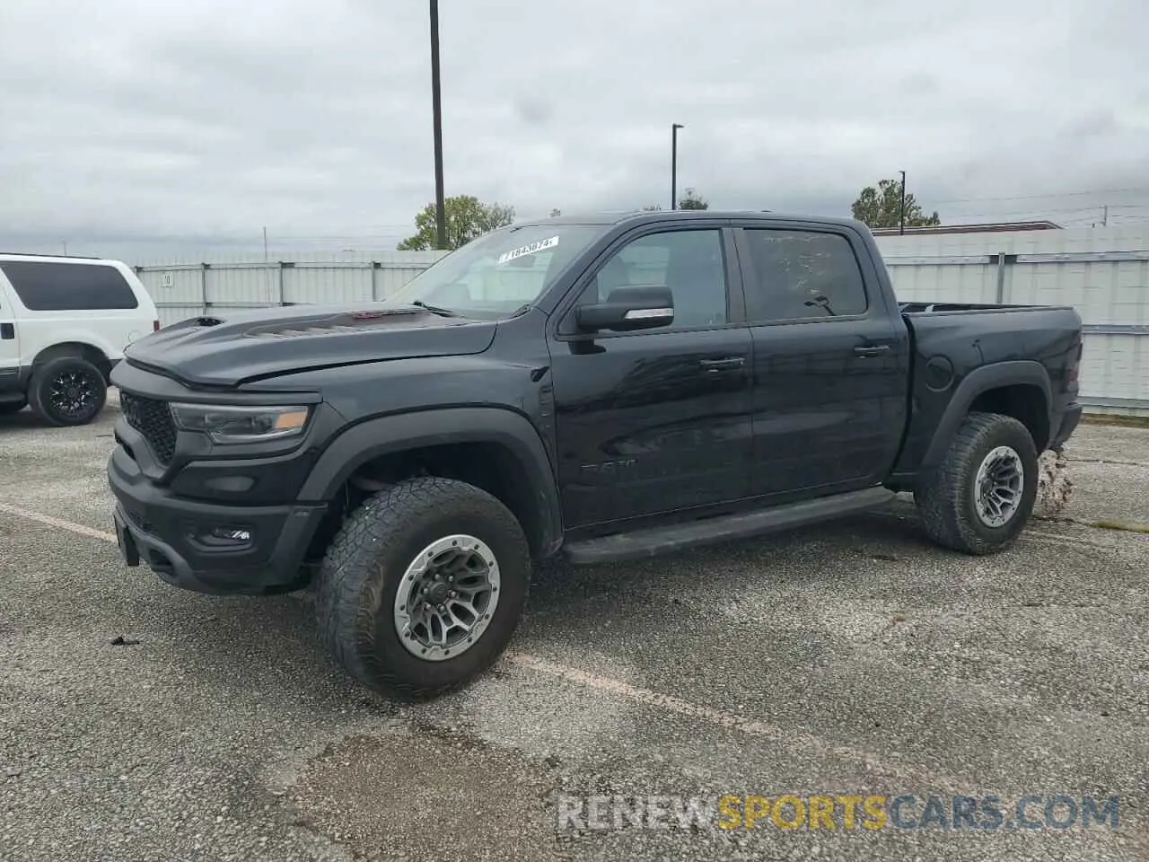 1 Photograph of a damaged car 1C6SRFU91MN902652 RAM 1500 2021