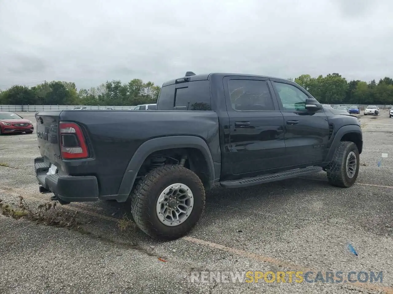 3 Photograph of a damaged car 1C6SRFU91MN902652 RAM 1500 2021