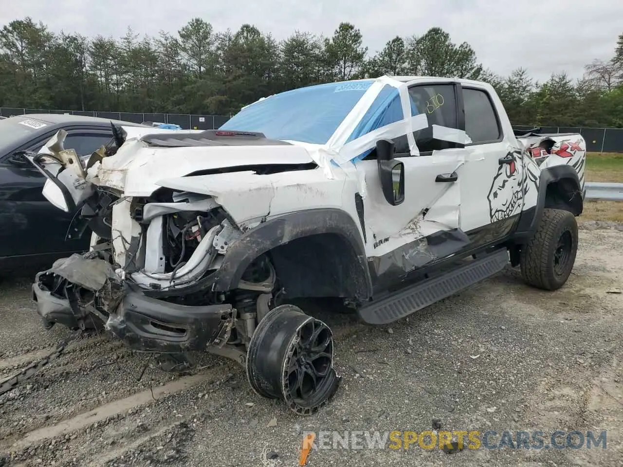 1 Photograph of a damaged car 1C6SRFU92MN718496 RAM 1500 2021