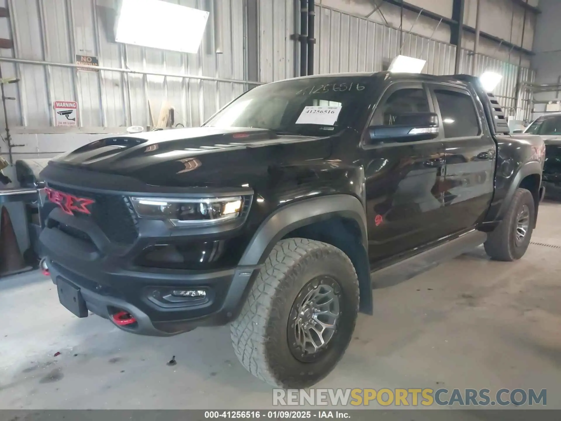 2 Photograph of a damaged car 1C6SRFU92MN902580 RAM 1500 2021