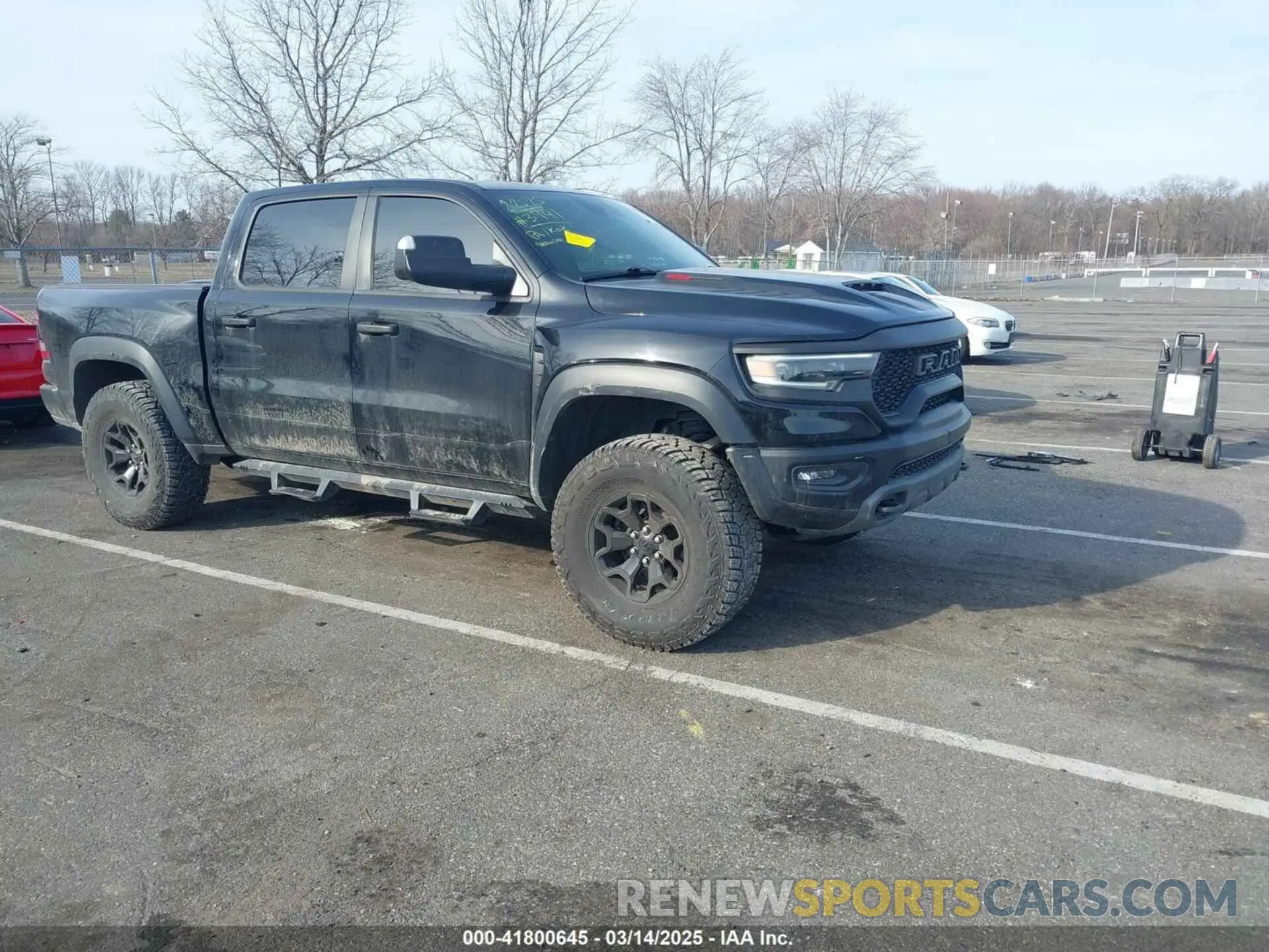 1 Photograph of a damaged car 1C6SRFU92MN903941 RAM 1500 2021