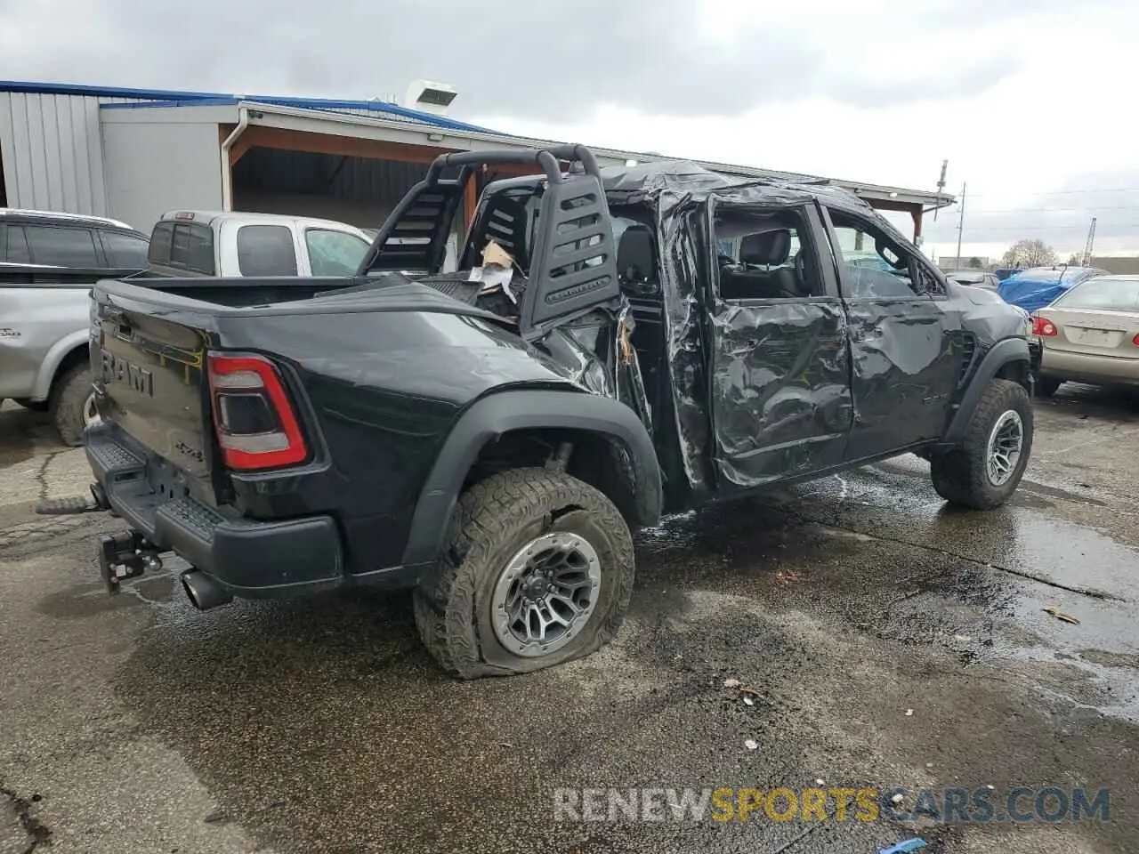 3 Photograph of a damaged car 1C6SRFU93MN719060 RAM 1500 2021