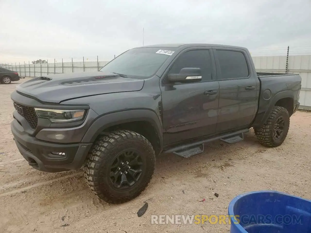 1 Photograph of a damaged car 1C6SRFU93MN760689 RAM 1500 2021