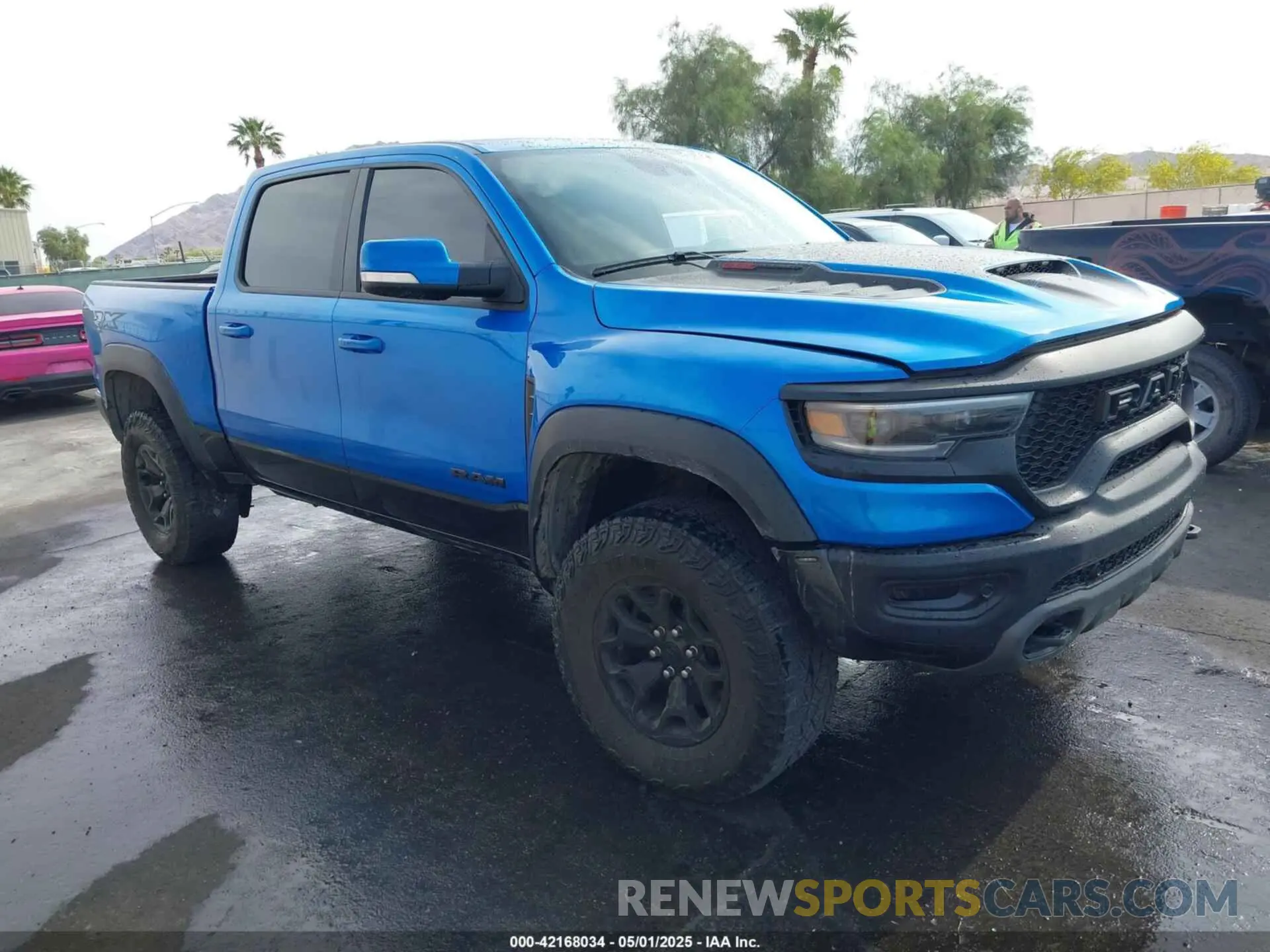 1 Photograph of a damaged car 1C6SRFU94MN705006 RAM 1500 2021