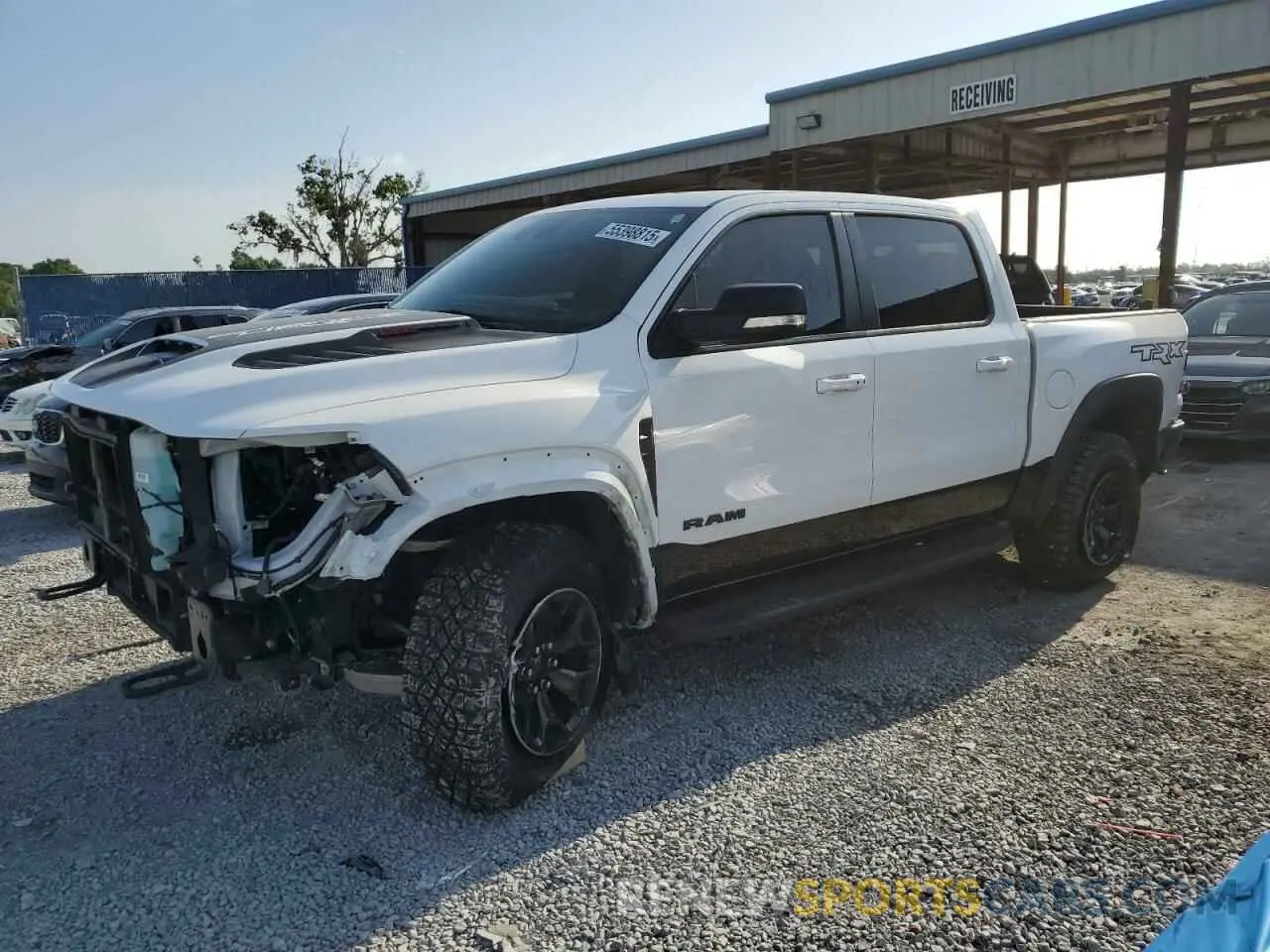 1 Photograph of a damaged car 1C6SRFU94MN762094 RAM 1500 2021