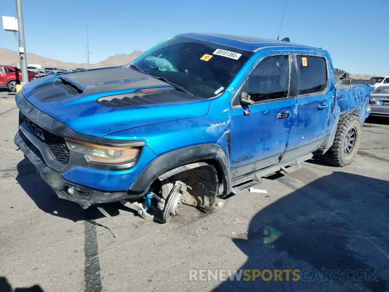 1 Photograph of a damaged car 1C6SRFU94MN783236 RAM 1500 2021