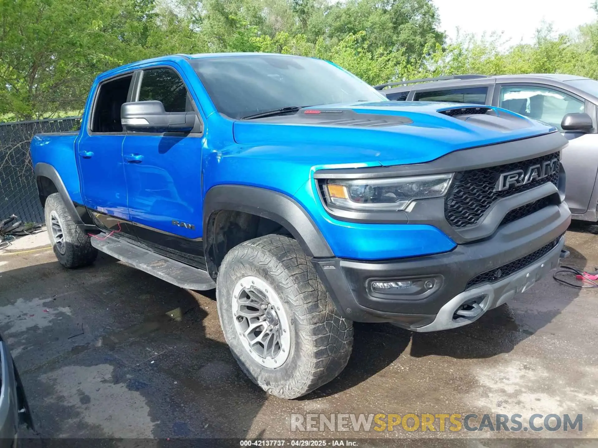1 Photograph of a damaged car 1C6SRFU94MN812802 RAM 1500 2021