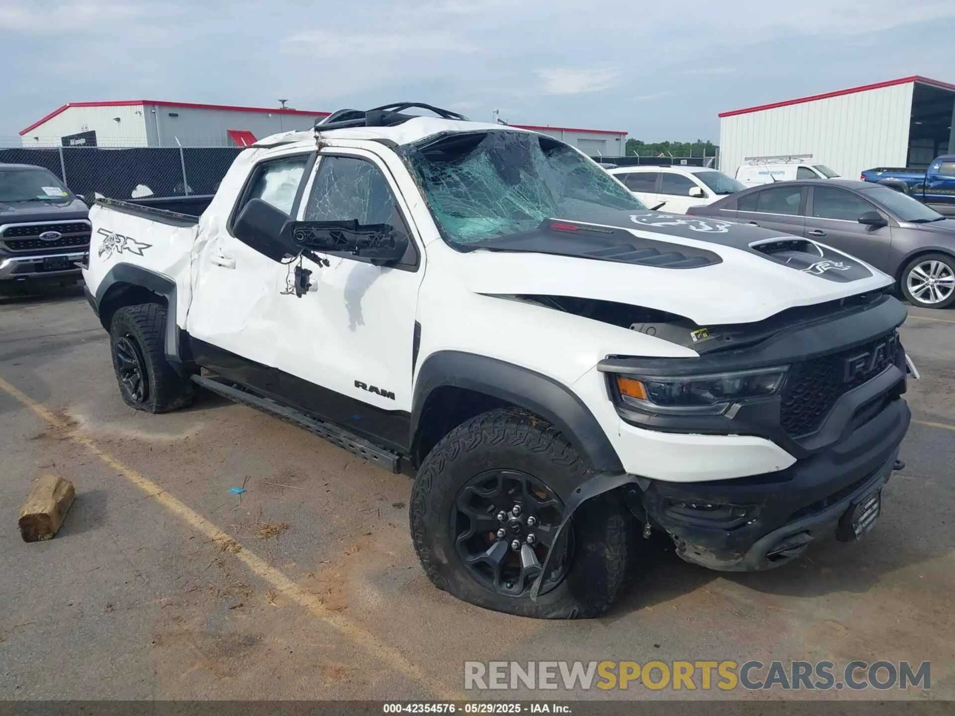 1 Photograph of a damaged car 1C6SRFU95MN904579 RAM 1500 2021