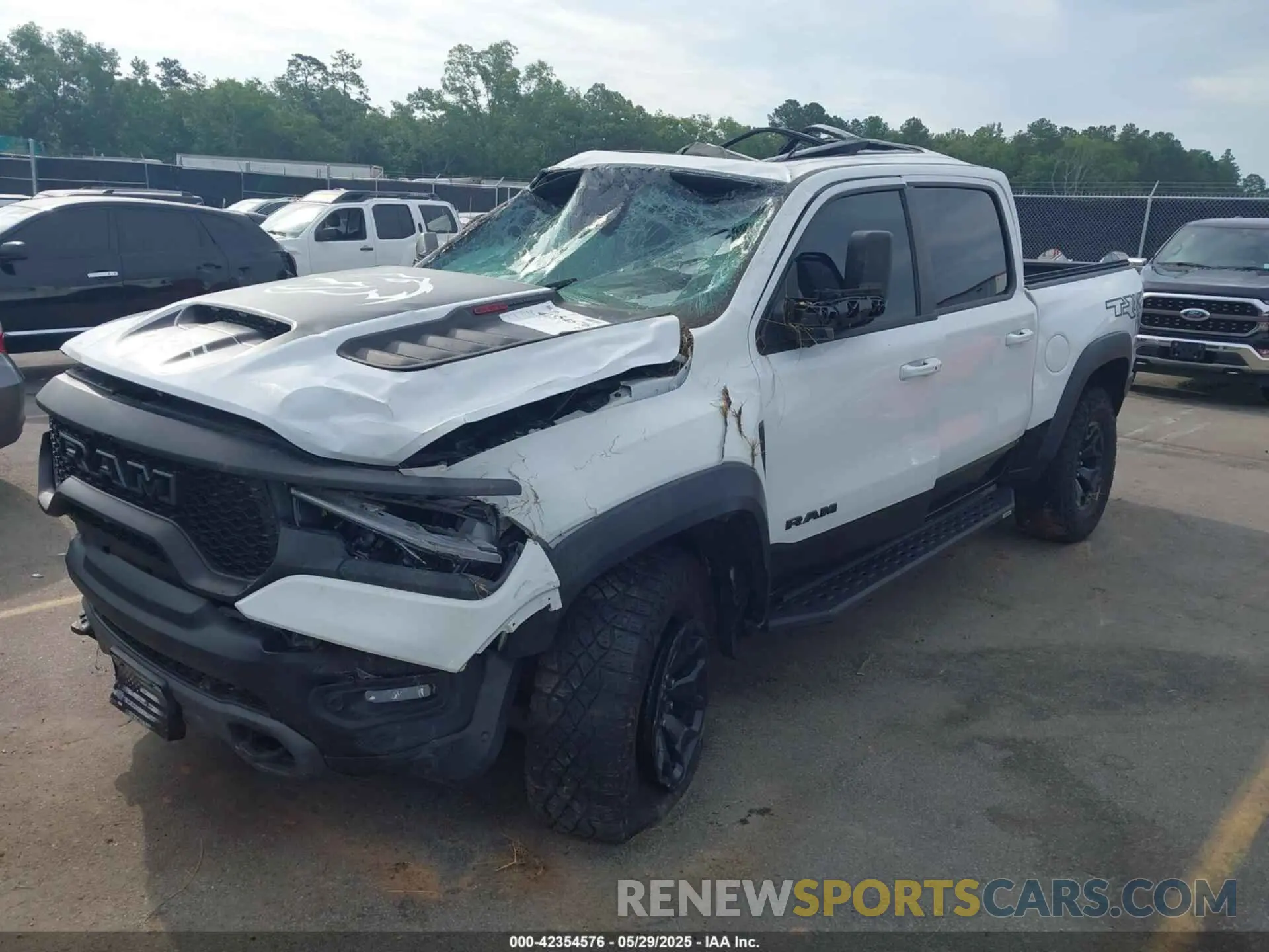 2 Photograph of a damaged car 1C6SRFU95MN904579 RAM 1500 2021