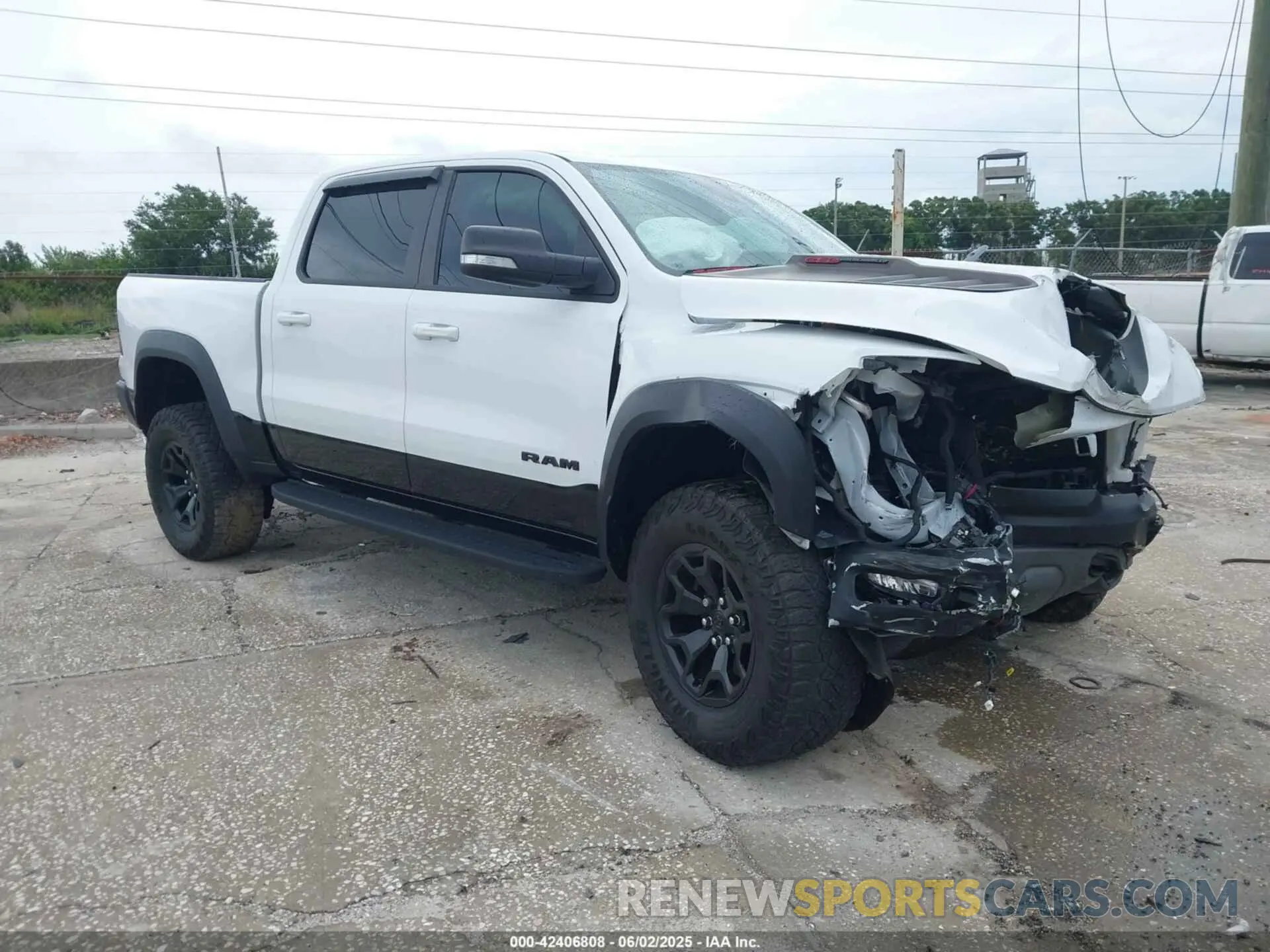 1 Photograph of a damaged car 1C6SRFU97MN719899 RAM 1500 2021