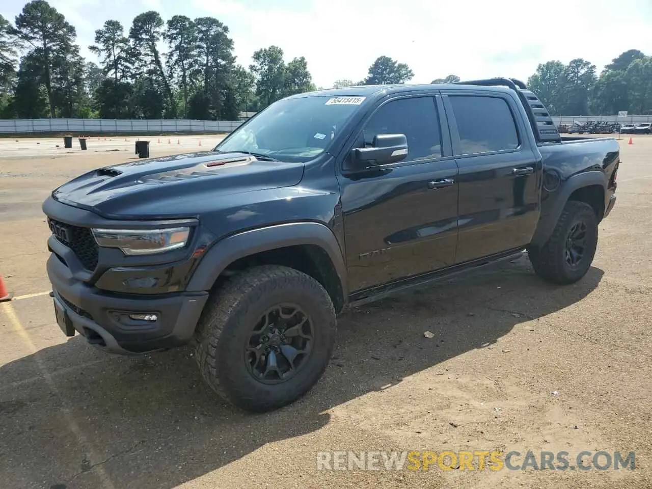 1 Photograph of a damaged car 1C6SRFU97MN727629 RAM 1500 2021