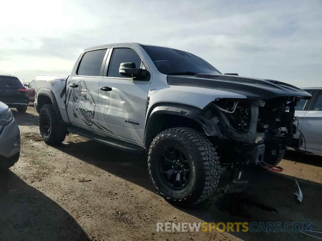 4 Photograph of a damaged car 1C6SRFU97MN791556 RAM 1500 2021