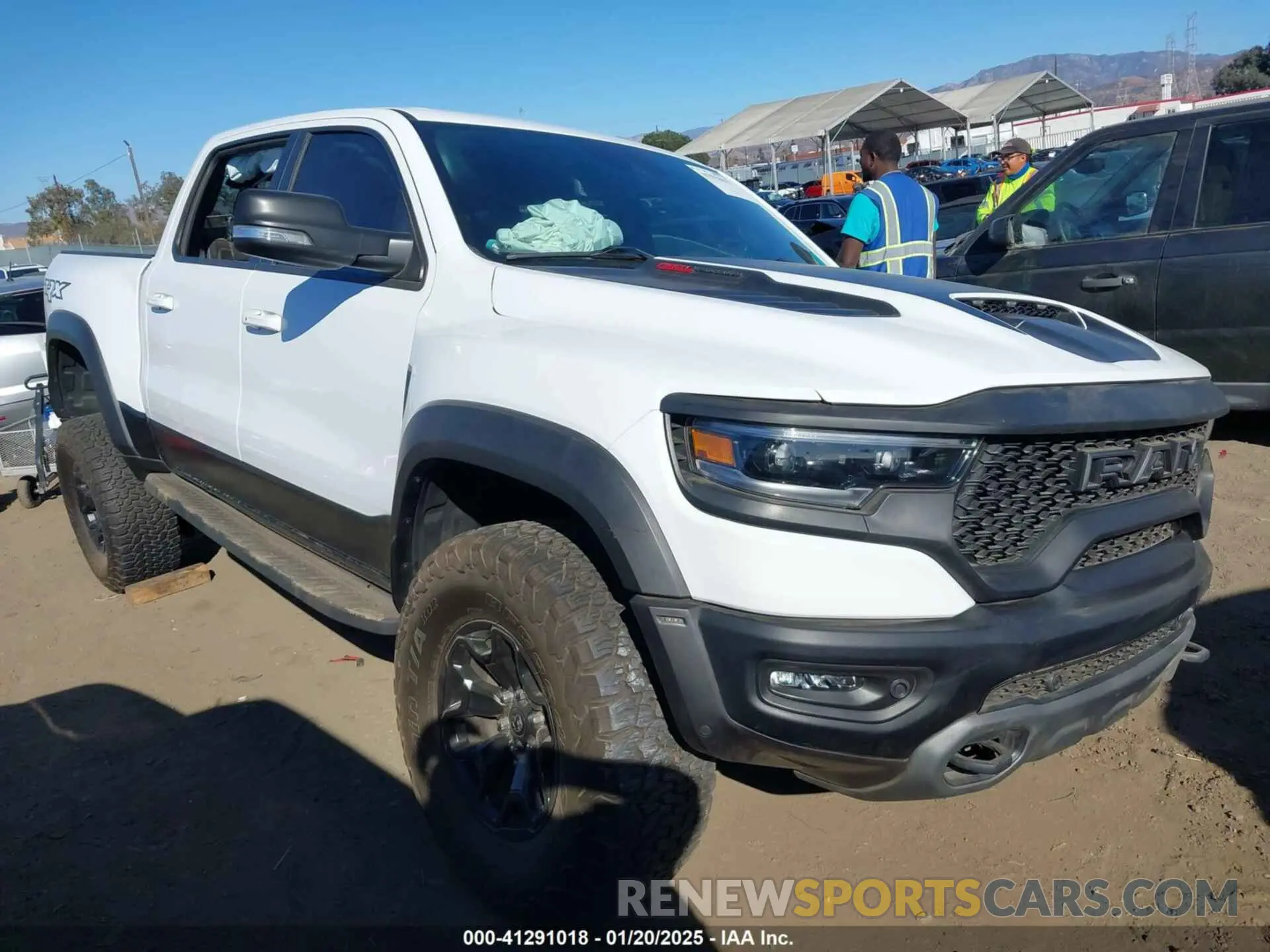 1 Photograph of a damaged car 1C6SRFU97MN906138 RAM 1500 2021