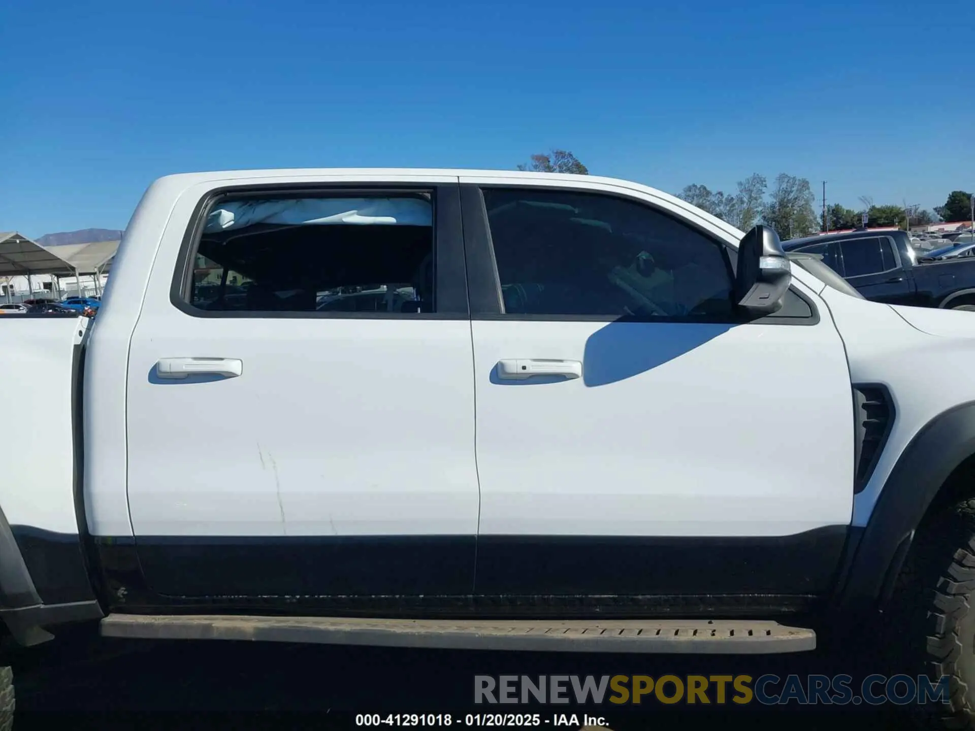 12 Photograph of a damaged car 1C6SRFU97MN906138 RAM 1500 2021