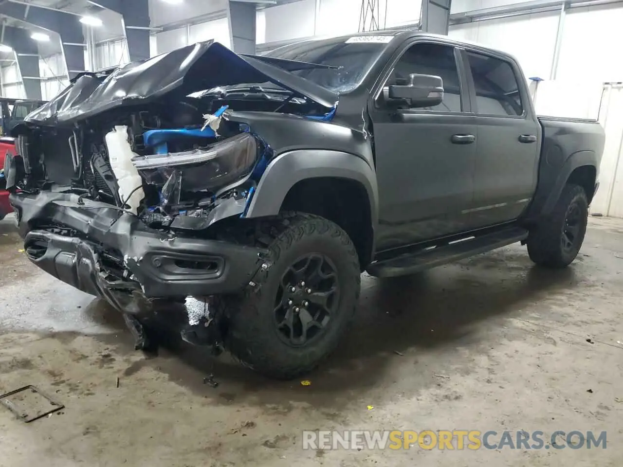 1 Photograph of a damaged car 1C6SRFU98MN754533 RAM 1500 2021