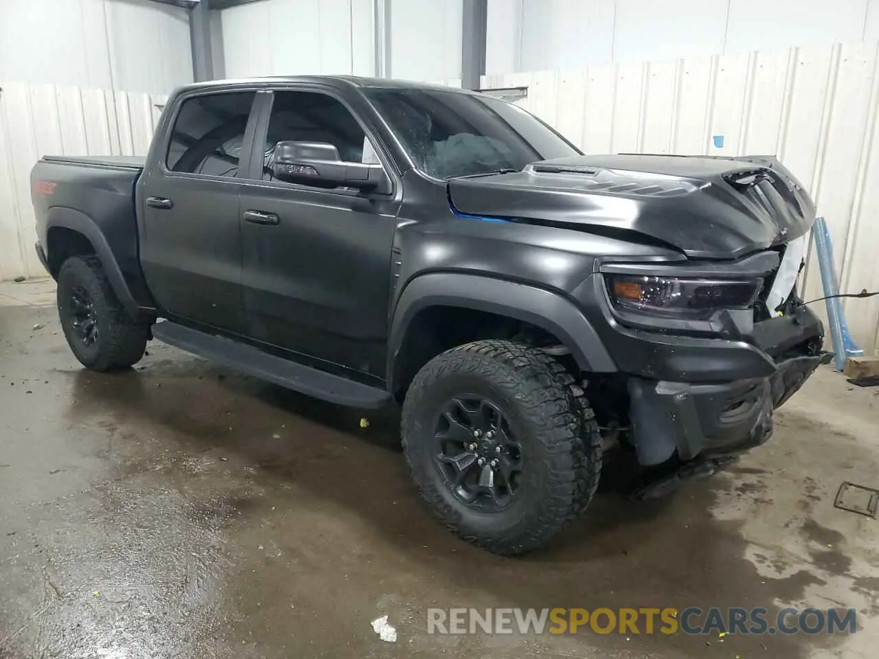 4 Photograph of a damaged car 1C6SRFU98MN754533 RAM 1500 2021