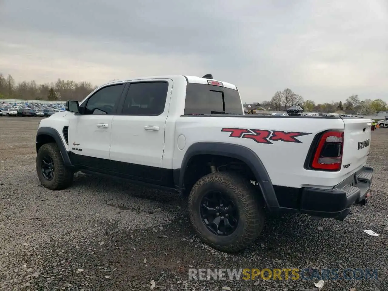 2 Photograph of a damaged car 1C6SRFU98MN764513 RAM 1500 2021