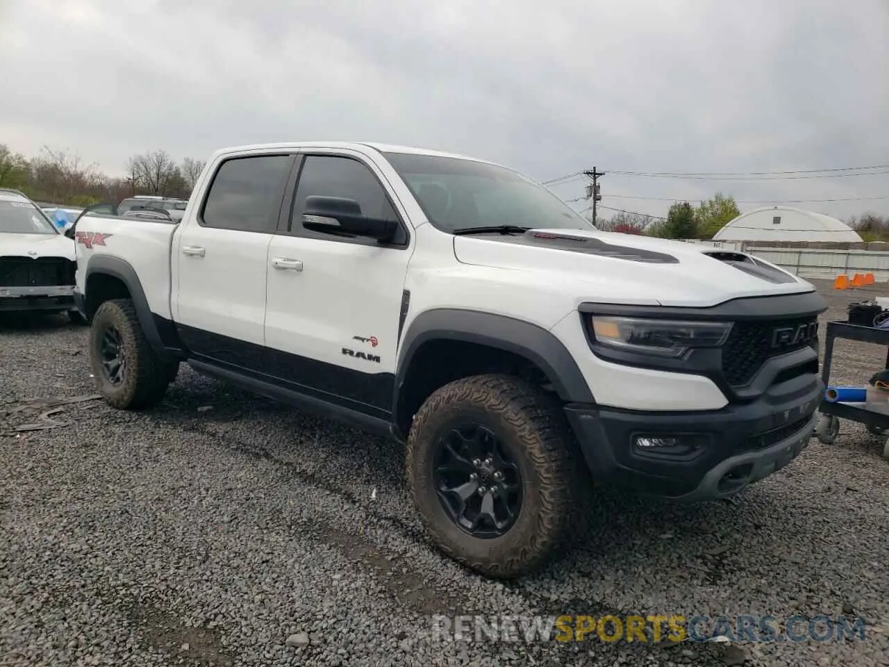 4 Photograph of a damaged car 1C6SRFU98MN764513 RAM 1500 2021