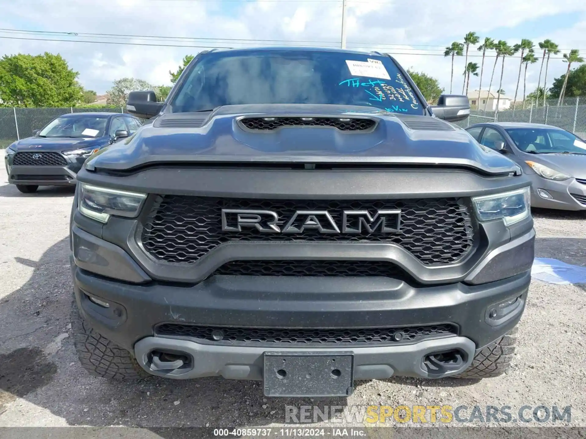 12 Photograph of a damaged car 1C6SRFU99MN738308 RAM 1500 2021