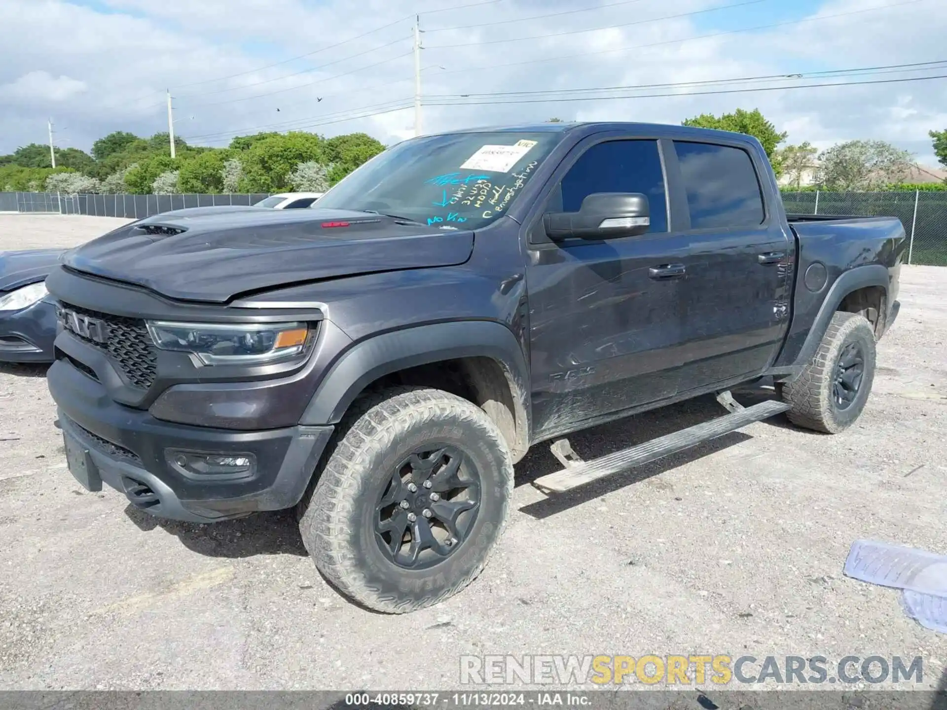 2 Photograph of a damaged car 1C6SRFU99MN738308 RAM 1500 2021