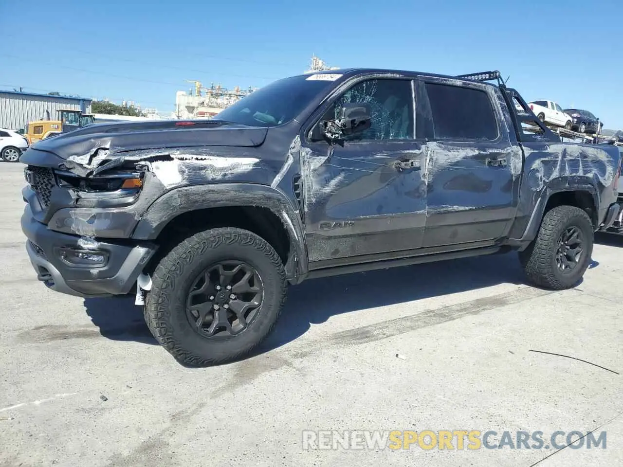 1 Photograph of a damaged car 1C6SRFU99MN744688 RAM 1500 2021
