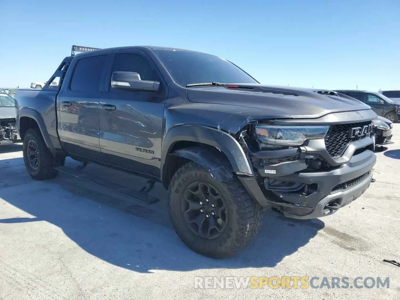 4 Photograph of a damaged car 1C6SRFU99MN744688 RAM 1500 2021