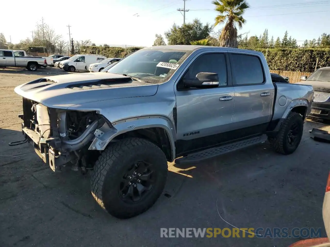 1 Photograph of a damaged car 1C6SRFU99MN781711 RAM 1500 2021