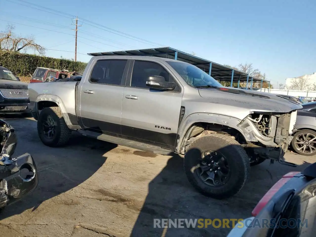 4 Photograph of a damaged car 1C6SRFU99MN781711 RAM 1500 2021