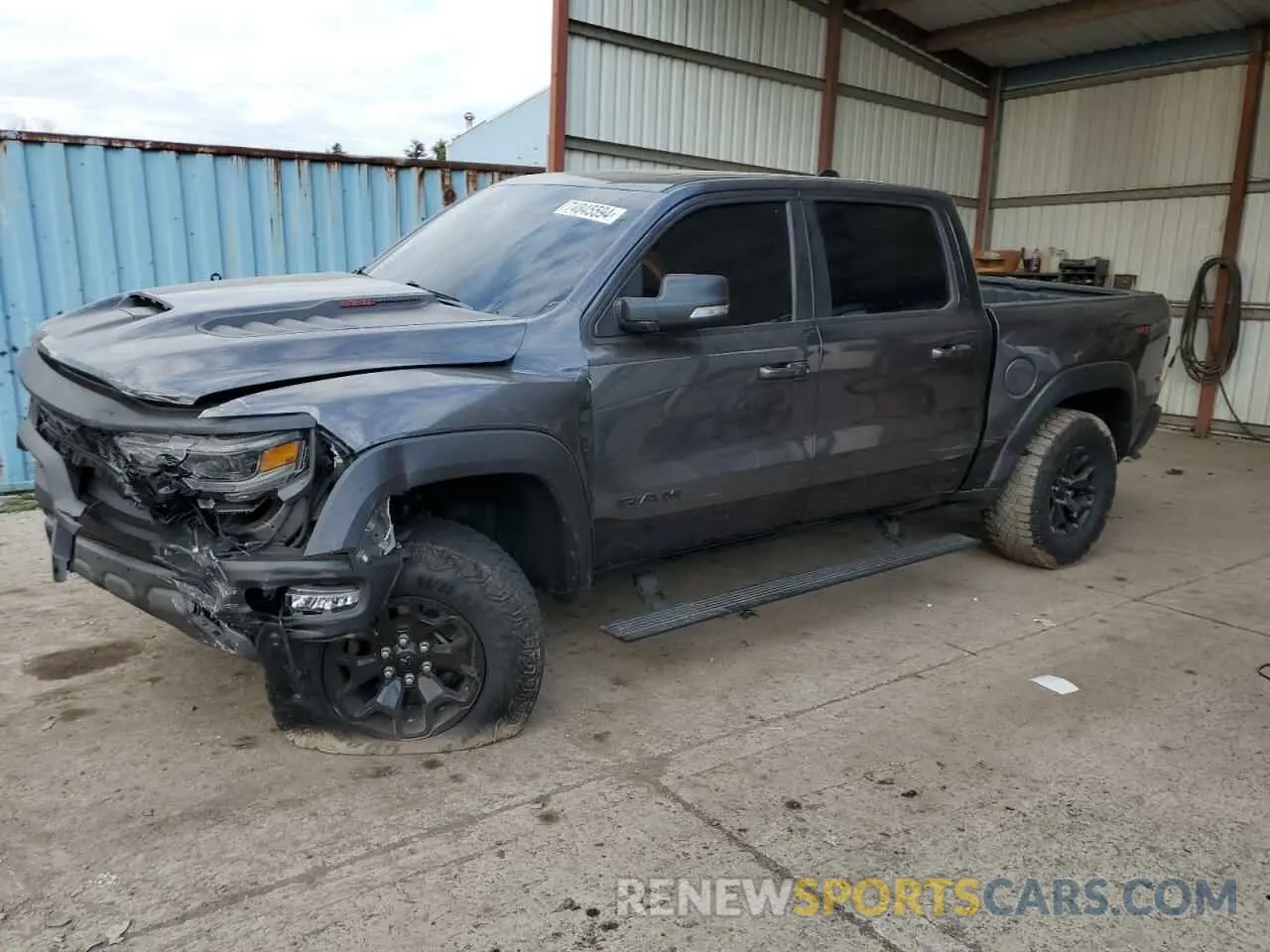 1 Photograph of a damaged car 1C6SRFU99MN804758 RAM 1500 2021